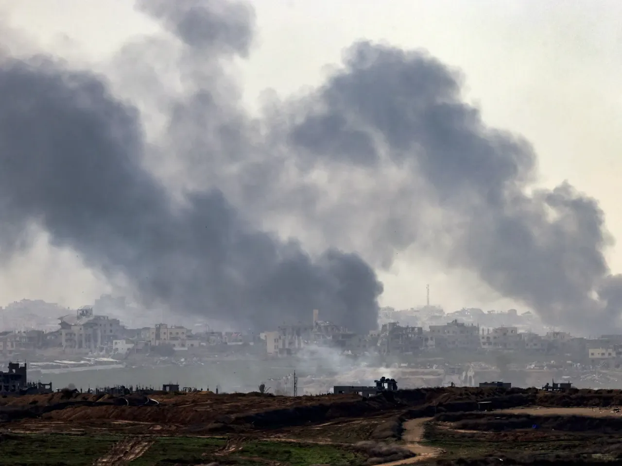Hamas and Israel are negotiating the release of 34 hostages from Gaza 1 A view from the southern Israeli city of Sderot shows smoke rising above destroyed buildings in the northern Gaza Strip during an Israeli army bombardment on Jan. 5.