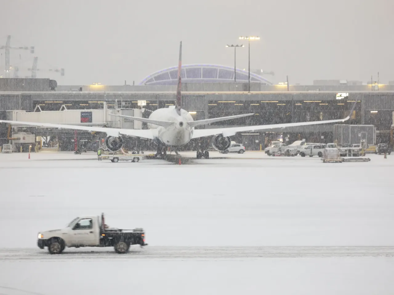 Snow blankets the Hartsfield-Jackson Atlanta International Airport on Friday as a winter storm moves into the Atlanta area.
