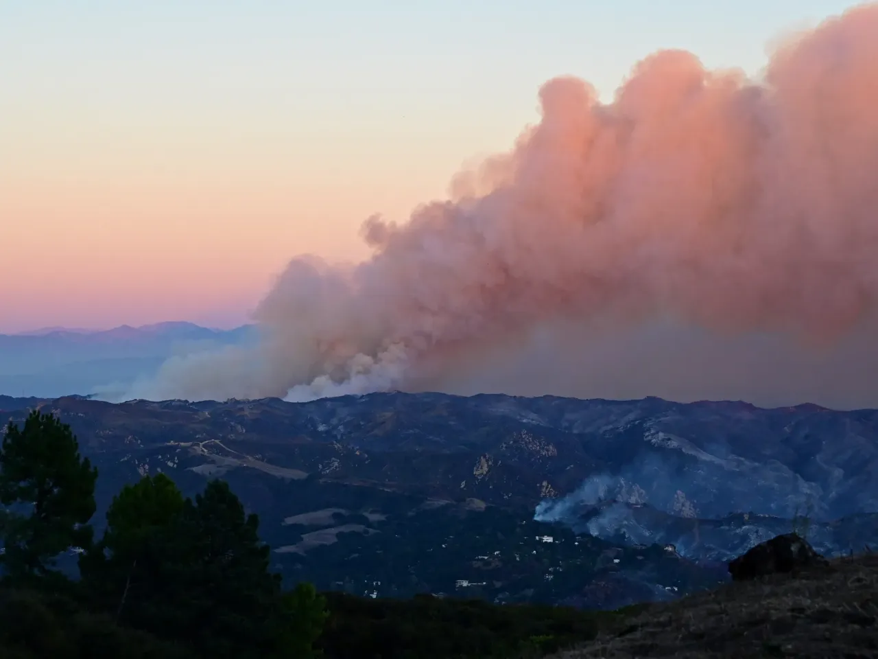 Friday, Jan. 10: Smoke billows from the Palisades fire as seen near Fernwood, Topanga, a community in western Los Angeles County.