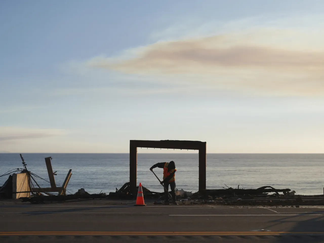 Friday, Jan. 10: A worker clears debris from the Palisades Fire in Malibu.