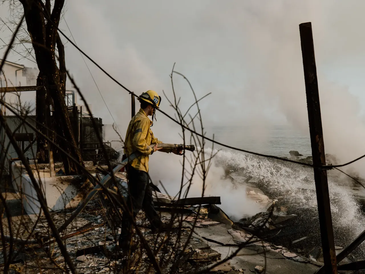 'The hydrants up here are dead.' Radio traffic shows how LA firefighters lost water 1 A firefighter works with water hoses near houses burned down in the Palisades Fire along the Pacific Coast Highway in Malibu, Calif. on Jan. 9, 2025.
