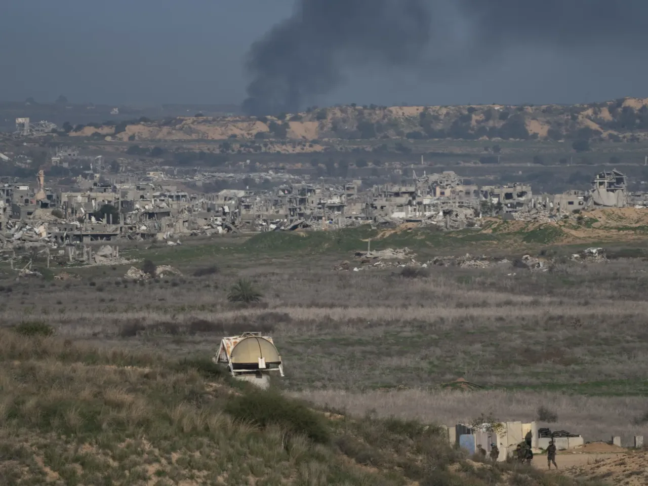Smoke rises after an explosion in northern Gaza, before a ceasefire deal between Israel and Hamas goes into effect, as seen from Israel on Sunday.
