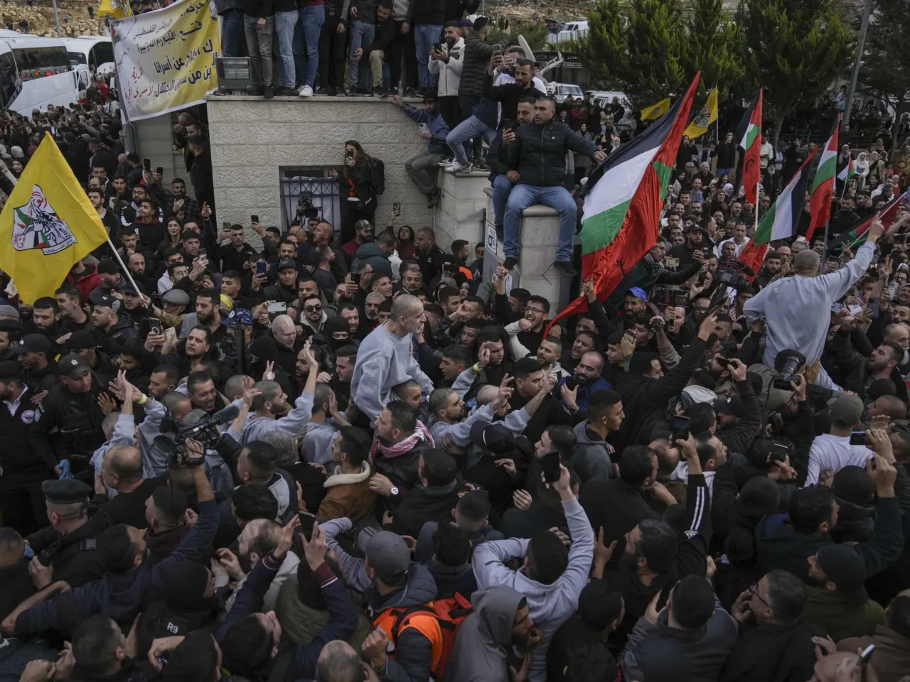 Hamas releases 4 more hostages as part of ceasefire agreement with Israel 4 Palestinian prisoners are greeted by a crowd after being released from Israeli prison following a ceasefire agreement with Israel, in the West Bank city of Ramallah, Saturday, Jan. 25, 2025.(AP Photo/Mahmoud Illean)