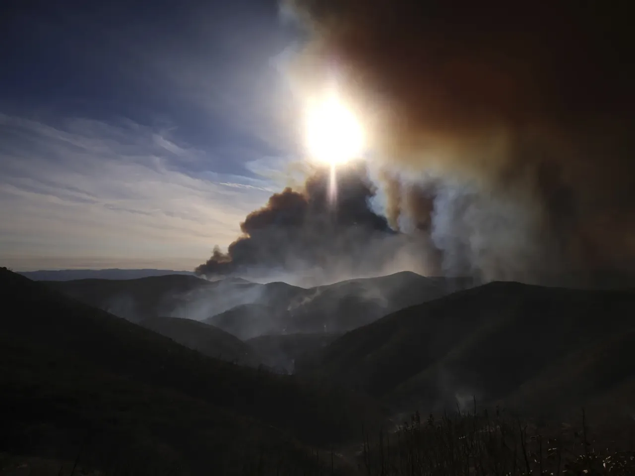 Farmworkers feed the country, but who protects them from wildfire smoke? 1 The Hughes Fire causes plumes of smoke over a mountainous area of Castaic, CA, Wednesday, Jan. 22, 2025. That smoke traveled to nearby Ventura County where around 40,000 farmworkers labor in nearby fields.