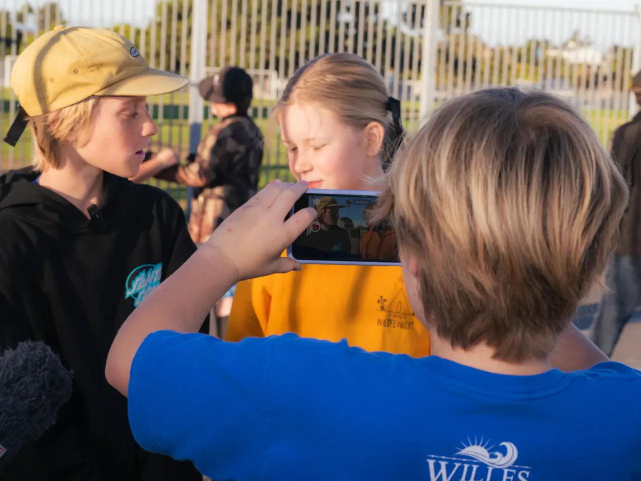 How many fourth-graders does it take to make a podcast? Here's what we learned 3 Students work on their reporting segment called "The Lions Share" for their broadcast news show.