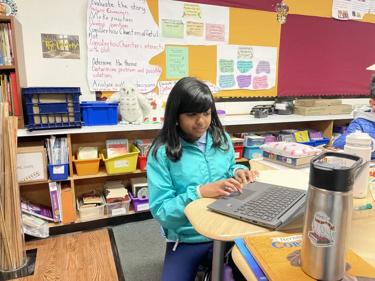 Fifth-grader Ameya Desai works at a research project that she's presenting to her class at Williams Elementary School in San Jose, Calif.