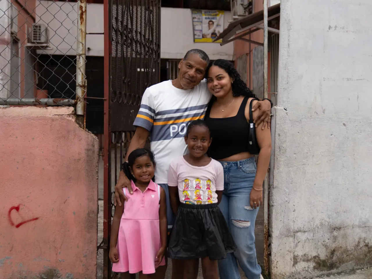 Samuel Ricaurte Castañeda (top left) with his daughter (top right) and granddaughters in front of his home in El Chorrillo.