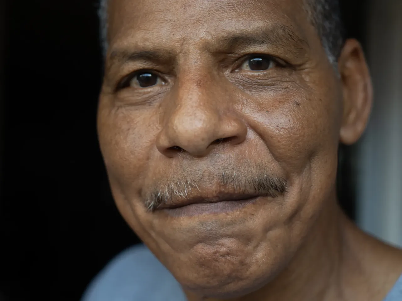 Samuel Ricaurte Castañeda in front of his former home in El Chorrillo. He was 27 when the U.S. invaded his neighborhood.