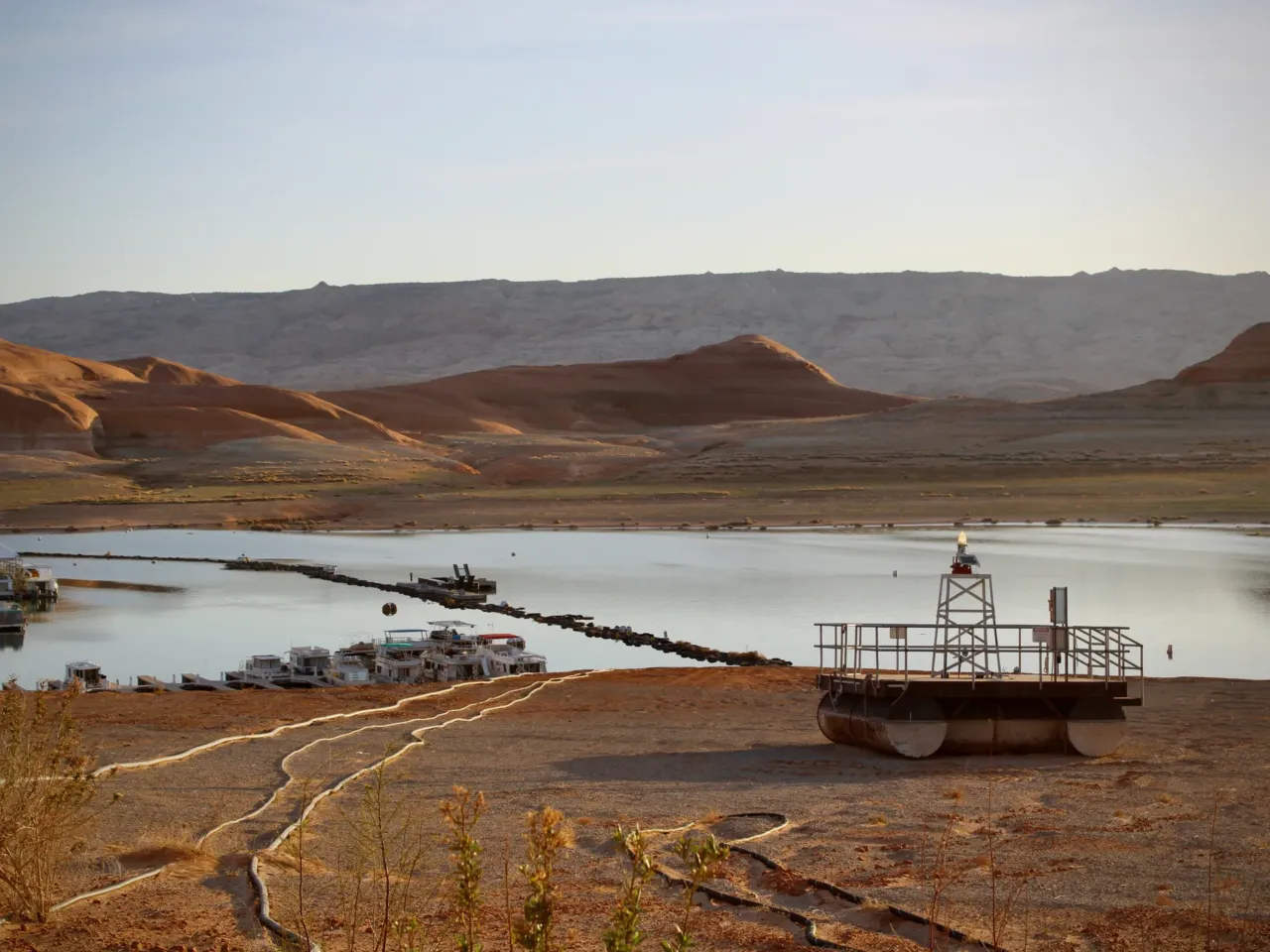 Trump funding freeze includes payments to keep the Colorado River flowing 1 Docks and buoys, once floating atop dozens of feet of water, sit stranded on the shores of Lake Powell on April 9, 2023. President Trump paused funding that was designed to help conserve water and boost the nation's largest reservoirs.