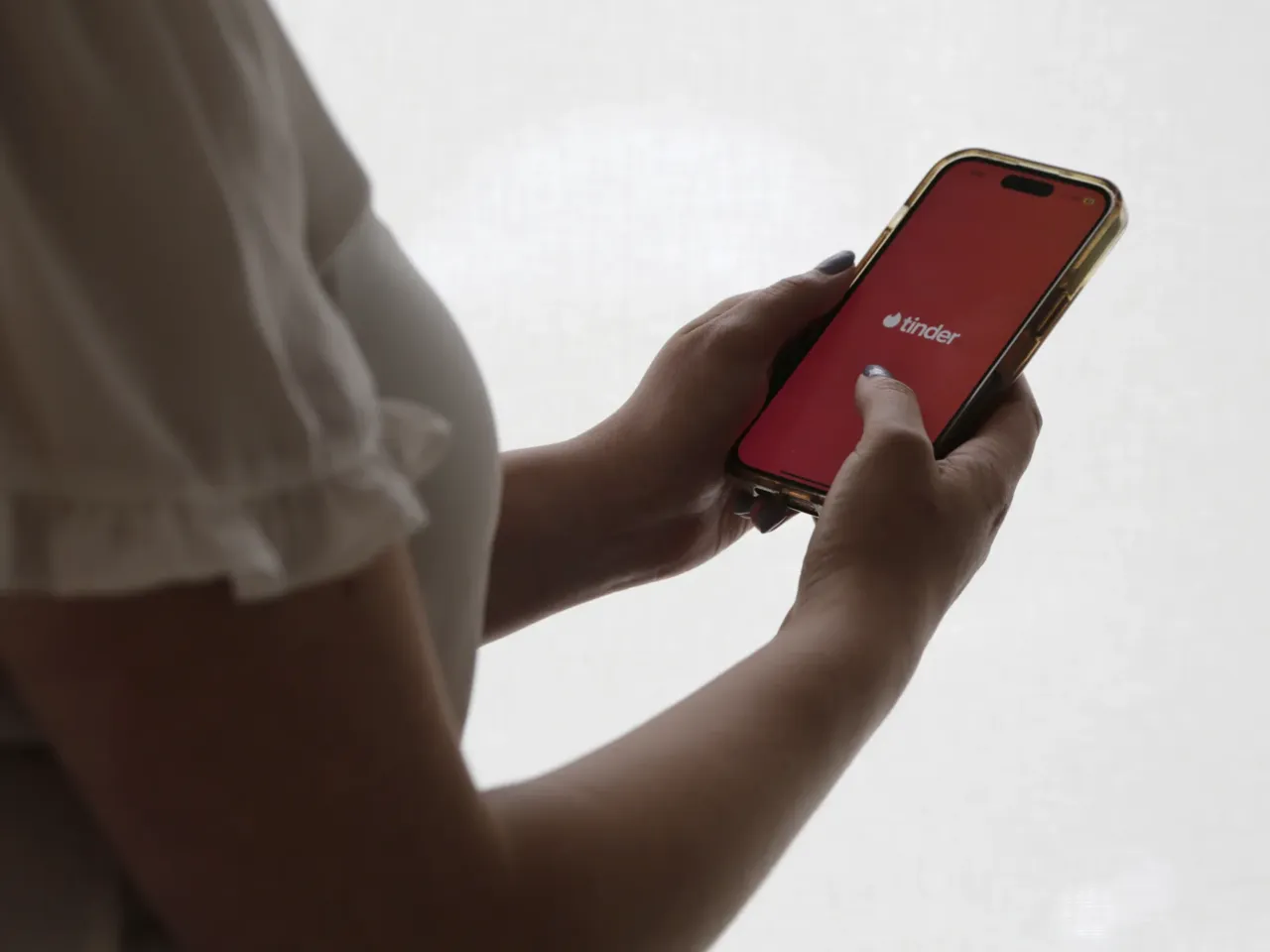 Individuals accused of rape or assault can easily remain on dating apps like Tinder, according to an 18-month investigation into Match Group. (AP Photo/Peter Morgan)