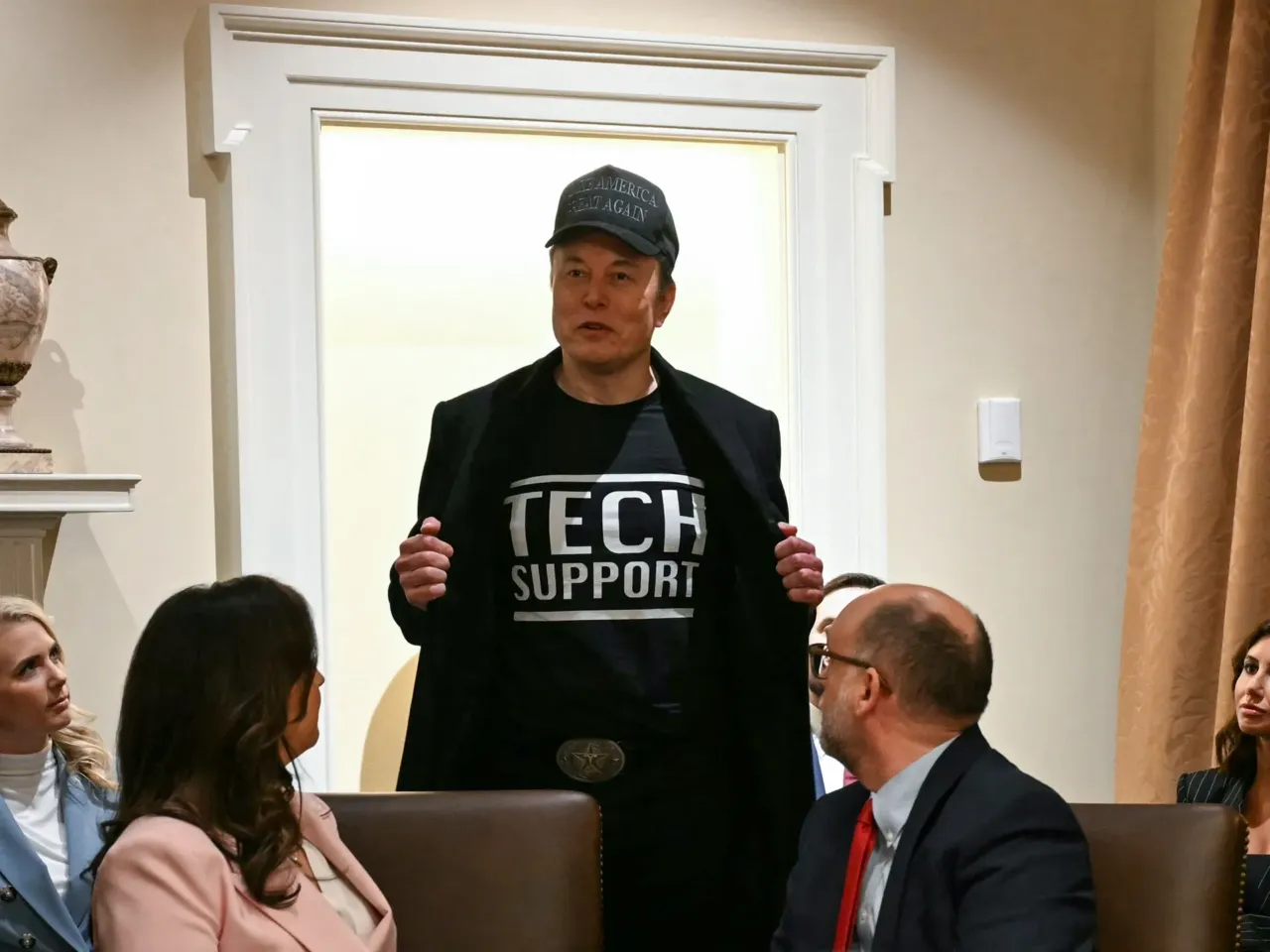 Musk says federal workers should expect another round of 'pulse check' emails 1 Leader of the Trump administration team called the Department of Government Efficiency, Elon Musk, wears a shirt that says "Tech Support" as he speaks during a Cabinet meeting with President Trump at the White House on Feb. 26.
