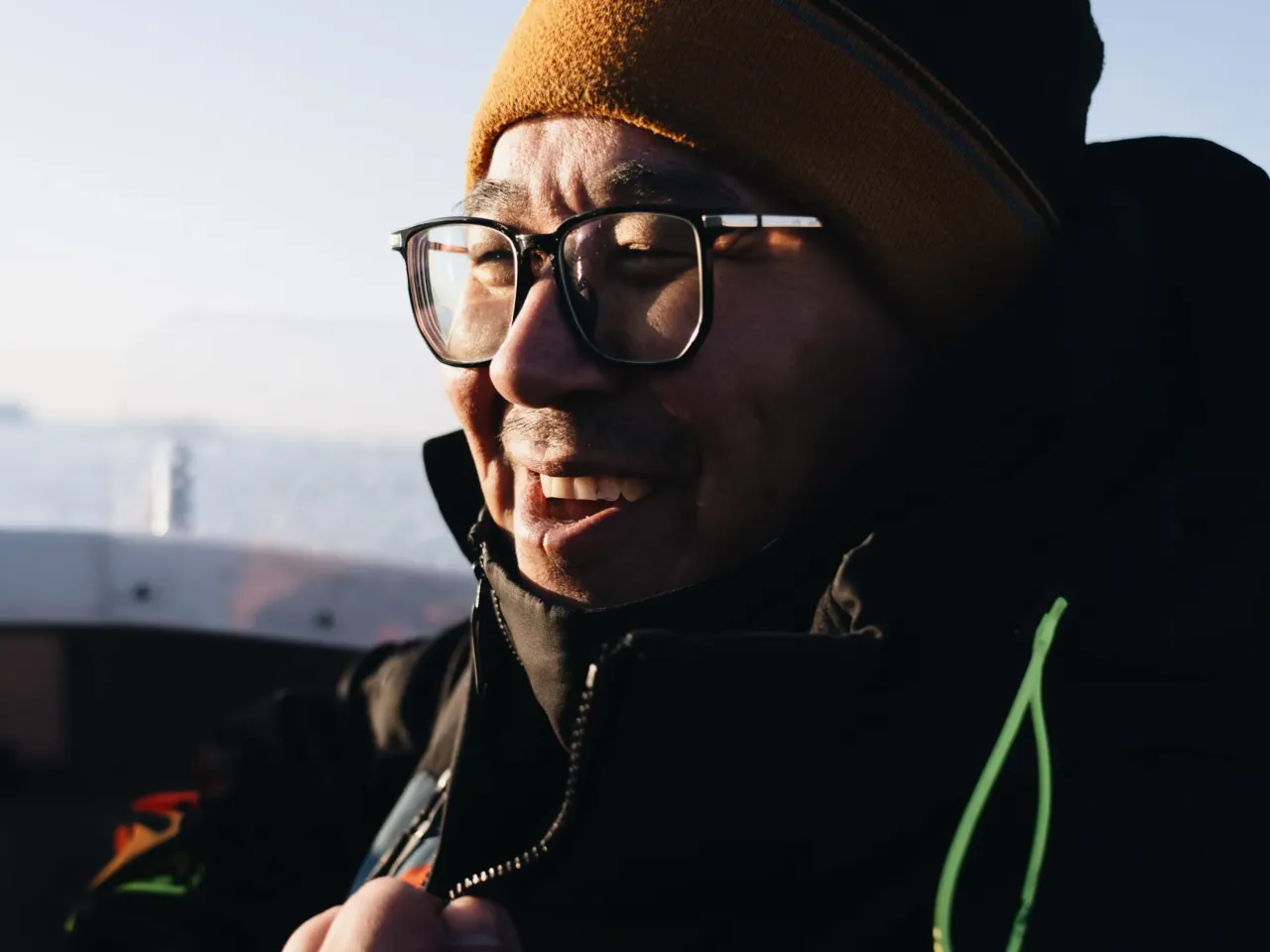 As Greenland prepares for tourism increase, a moment of stillness among the icebergs 3 Jan Cortsen is all smiles as he takes NPR out for a ride.