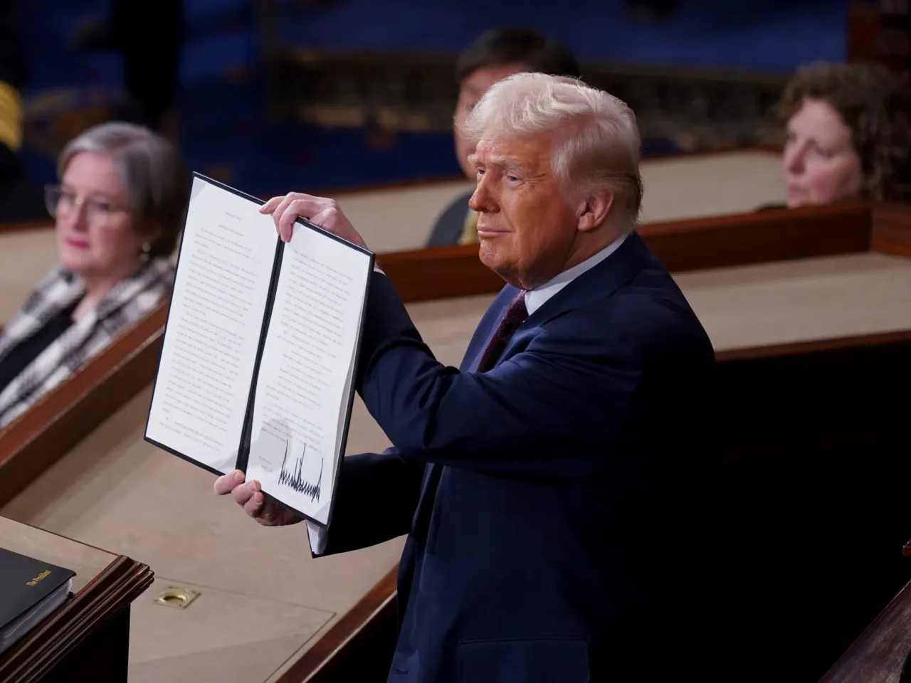 From cheers to protests, here's a look inside the chamber during Trump's speech 7 President Trump holds a signed executive order that renames a wildlife sanctuary in honor of late Jocelyn Nungaray during a joint session of Congress in the House Chamber of the US Capitol.