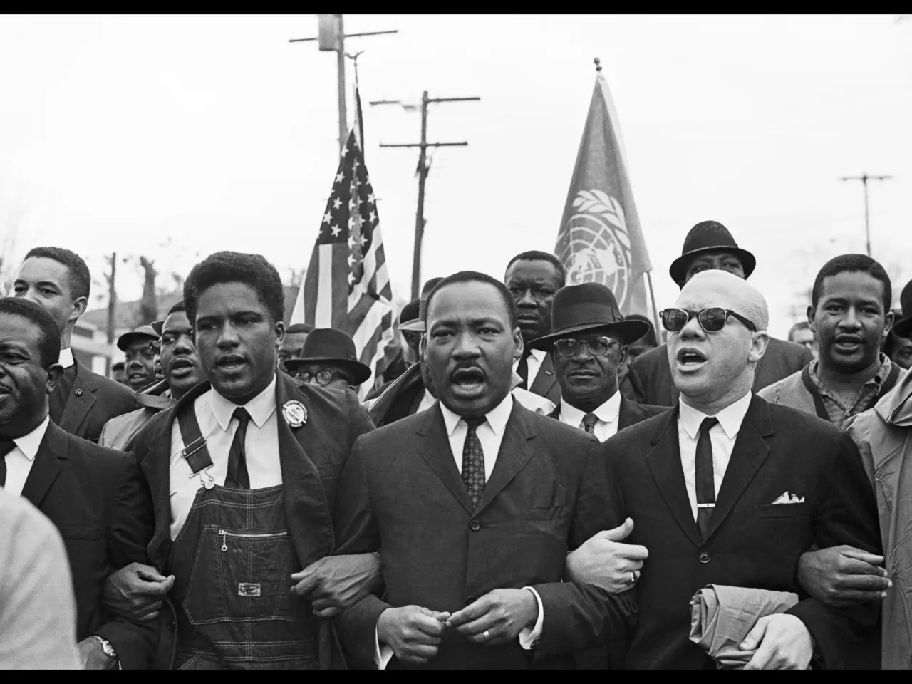 Rev. Ralph Abernathy, James Forman, Dr. Martin Luther King Jr. and Rev. Jesse Douglas lead the voting rights march to the Montgomery County Courthouse.