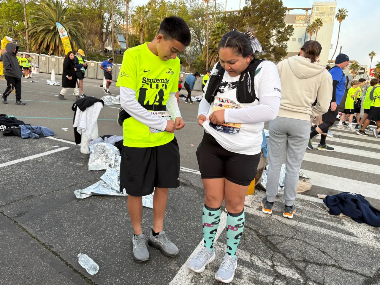He lost his first LA Marathon medal in the fires — this weekend he got his second 1 Abel Rivera and his mother, Lupe Melchor, pin on their race bibs at Dodger Stadium, the starting point of the 26.2 mile LA Marathon.