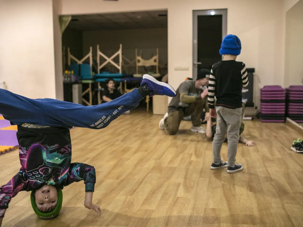 Children from the eastern city of Kharkiv in Ukraine learn how to breakdance to relieve tension and stress from the ongoing war in their city and country — a moment of joy amid the sorrows of conflict.