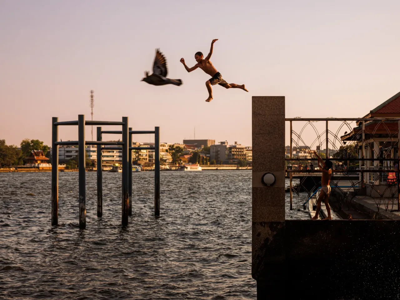 The boy and bird are, of course, not really flying together. But ... they are both airborne. The child is jumping into the Chao Phraya river in Bangkok, Thailand, during a heatwave in February 2024. Photographer Andre Malerba notes: "This image recalls the free feeling of leaping from several times one's height into water to escape the heat as friends laugh and cheer you on. A time many of us might remember as when we felt truly whole and at peace, even if life wasn't perfect. It's always worth realizing that this version of ourselves still exists somewhere inside and to let that lend us a sense of well-being that can never be taken away."