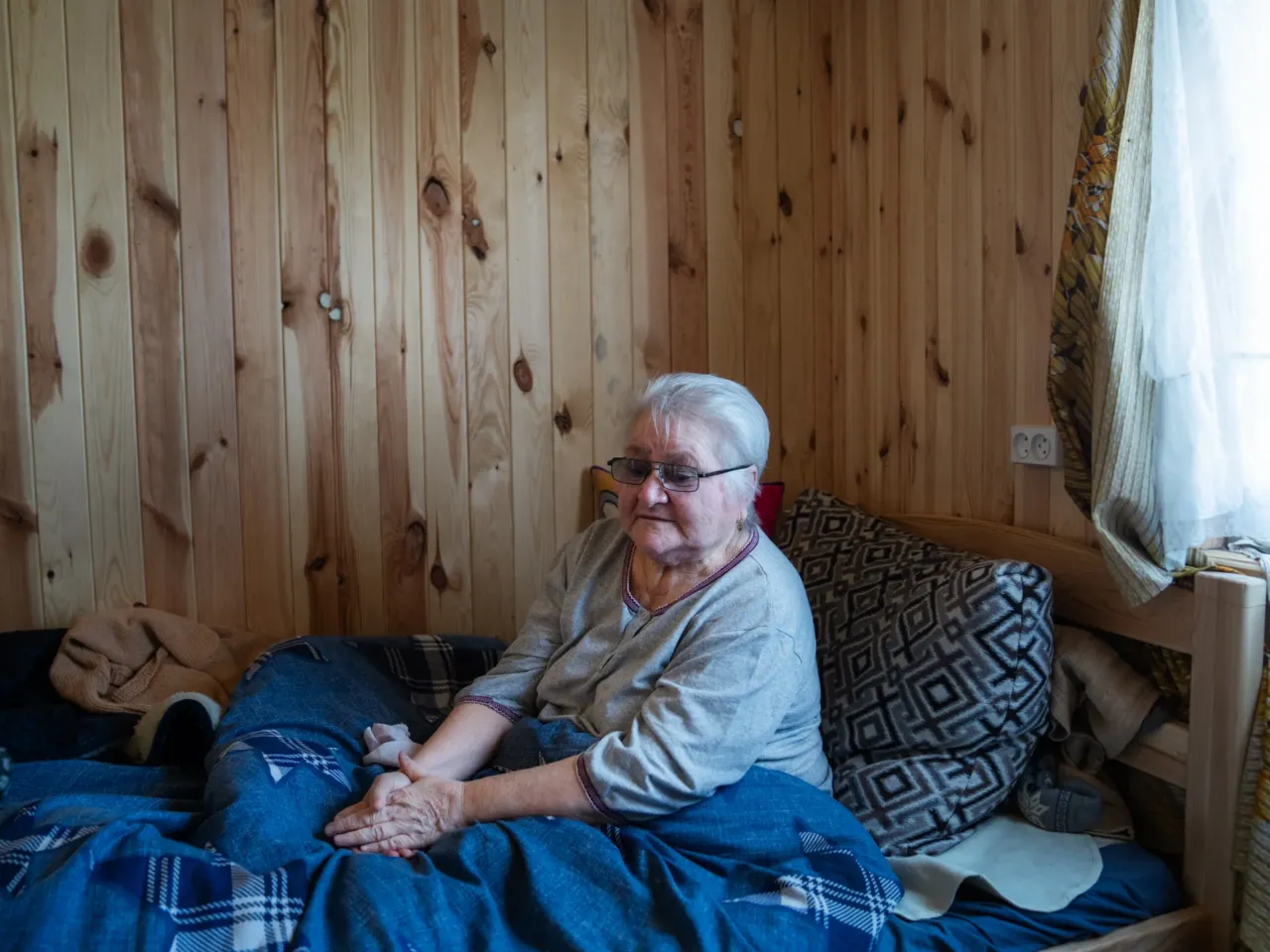 Ukrainians in front-line regions reel from losses, but say hope dies last for them 2 Neonila Prytsyk sits in her bed in a temporary housing unit in Posad-Pokrovske, on the land where her home stood before it was destroyed. "We had everything. I won't be shy to state that I was a good homeowner. I had everything. From a spoon and a cup, to plates and gifts," she remembers. She had to prioritize taking her wheelchair and walker when she evacuated because she is disabled after a stroke eight years ago.