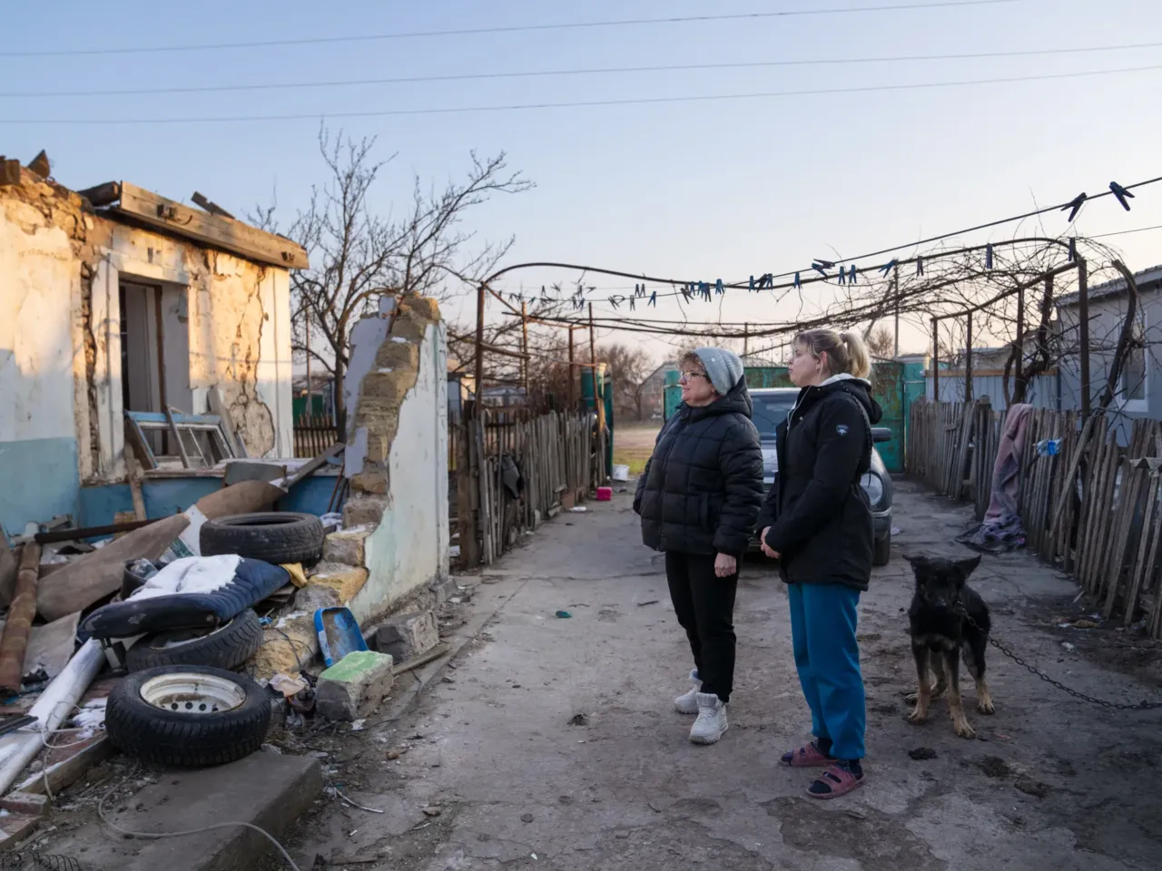 Ukrainians in front-line regions reel from losses, but say hope dies last for them 7 Oksana Hnedko (left) talks with Zeleny Hai resident Nina Kolesnik, 32, about the remnants of her old home on one side of her property. A temporary unit where she lives now is on the other side.
