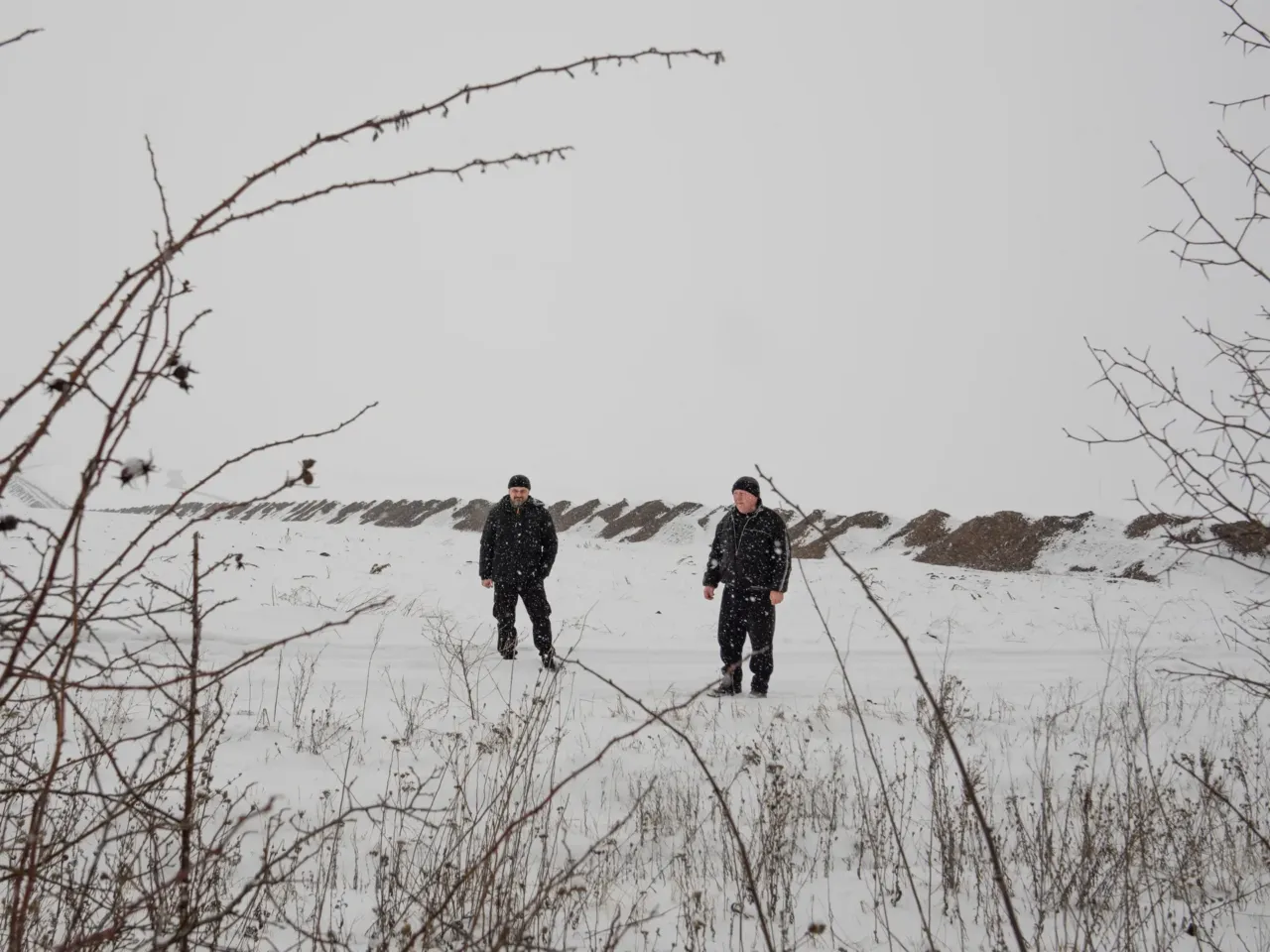 Ukrainians in front-line regions reel from losses, but say hope dies last for them 12 Konstyantyn Hordienko (left) and his father Viktor Hordienko stand on a road that leads to their land in Staryi Saltiv. Viktor sometimes goes just to check on the land, tallying the damage. "One field got hit 19 times. Mortars. The other one nine times. And it all stayed there. Wheat stayed there. It all grew up in three years with weeds. All rotten," says Viktor.