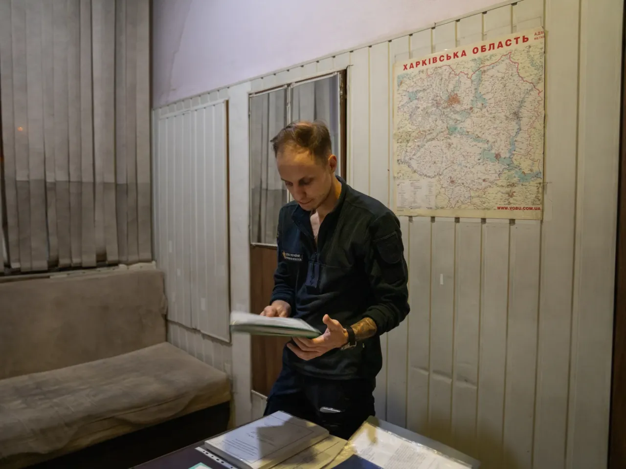 Ukrainians face fears during the country's darkest nights 3 Volodymyr Lohinov stands in his office at the fire station where he works in Kharkiv. He sometimes tries to sleep on the couch in his office, but much of the time he is up at night filling out paperwork with details of the calls he went out on. He says it sometimes grounds him after major disasters. The only night he was relieved from doing paperwork was last April, when his father was killed.