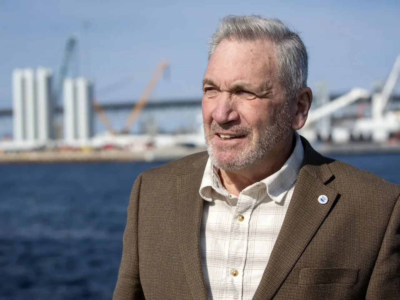 New London Mayor Michael Passero says offshore wind has contributed to the city's recent renaissance. Behind him sits the State Pier Terminal, the centerpiece of the local industry.