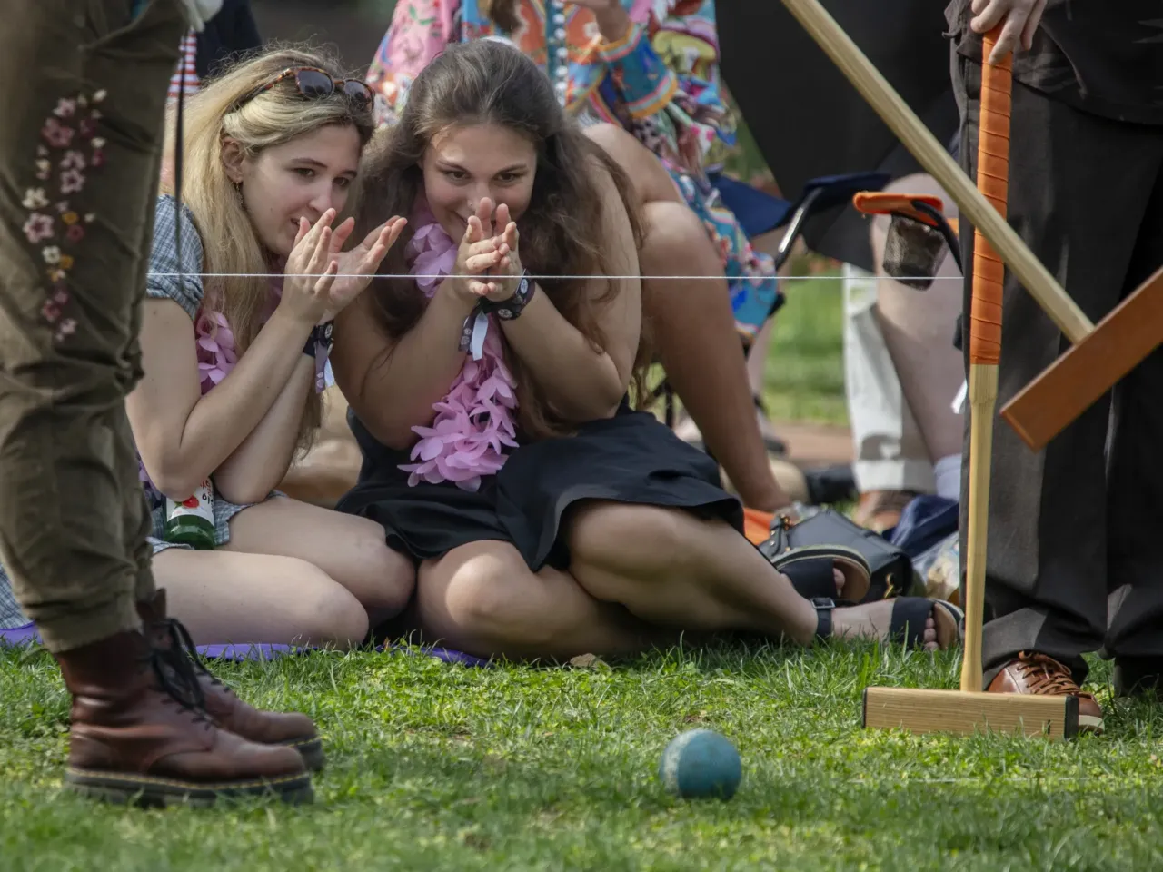 'The lawn giveth and the lawn taketh away': Photos from the 41st Annapolis Cup 7 Brynn Myers and Lindsay Irmiter, juniors at St. John's College, wiggle their "good luck" fingers as they root for the Johnnies.