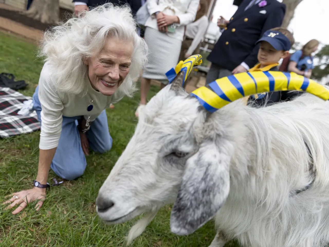 'The lawn giveth and the lawn taketh away': Photos from the 41st Annapolis Cup 13 Linda Stilwell Larson, a resident of Annapolis, greets one of the Naval Academy's mascots at the match.