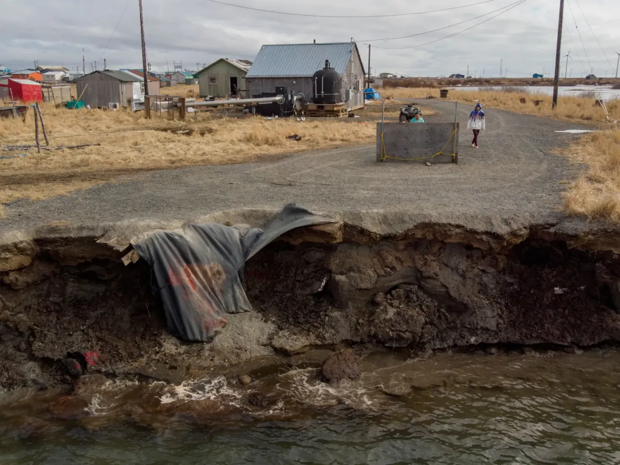 Homes in the Yupik Eskimo Village of Quinhagak on the Yukon Delta in Alaska are threatened by shoreline erosion as climate change makes the planet warmer. More than 22 tribes and nonprofits in the U.S., including Alaska, have had millions of dollars in federal funds for infrastructure projects frozen. Some of those projects were meant to help address the impacts of climate change.