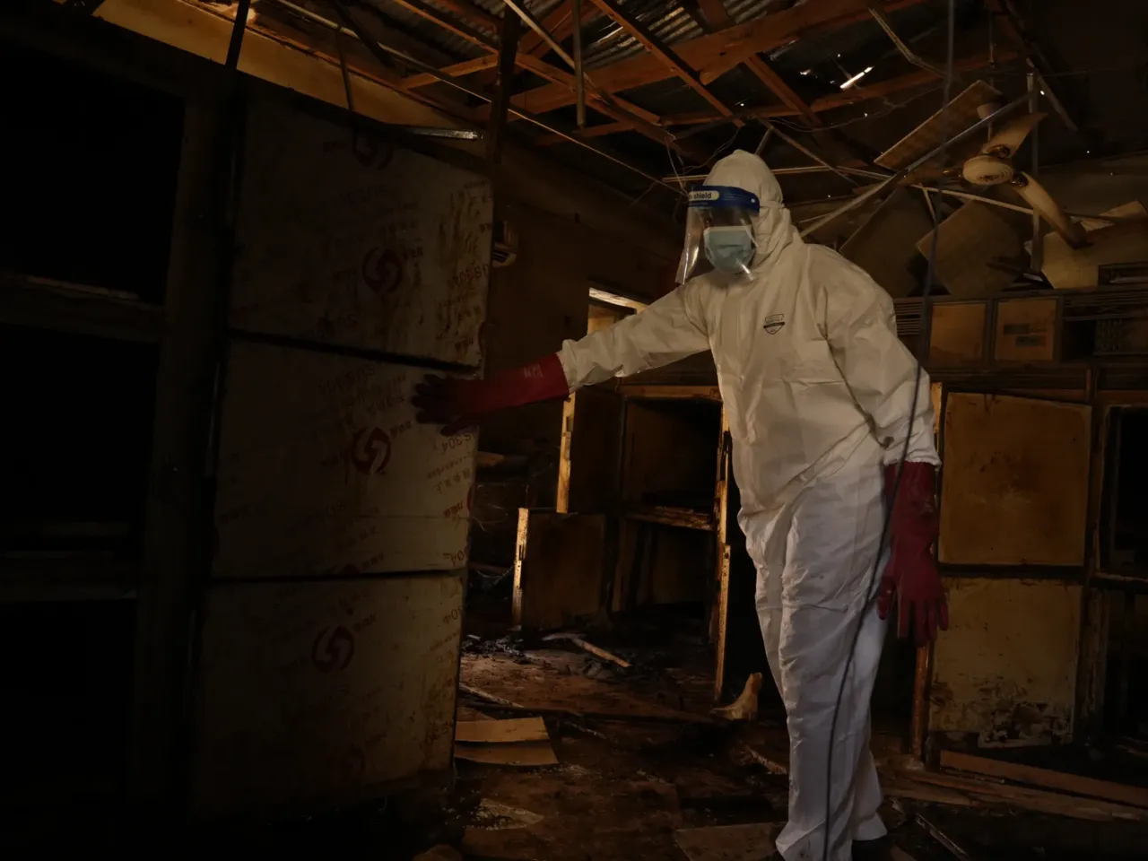 Photos: 2 years of war in Sudan 11 A member of the Sudanese Armed Forces searches for bodies in Omdurman in 2024.