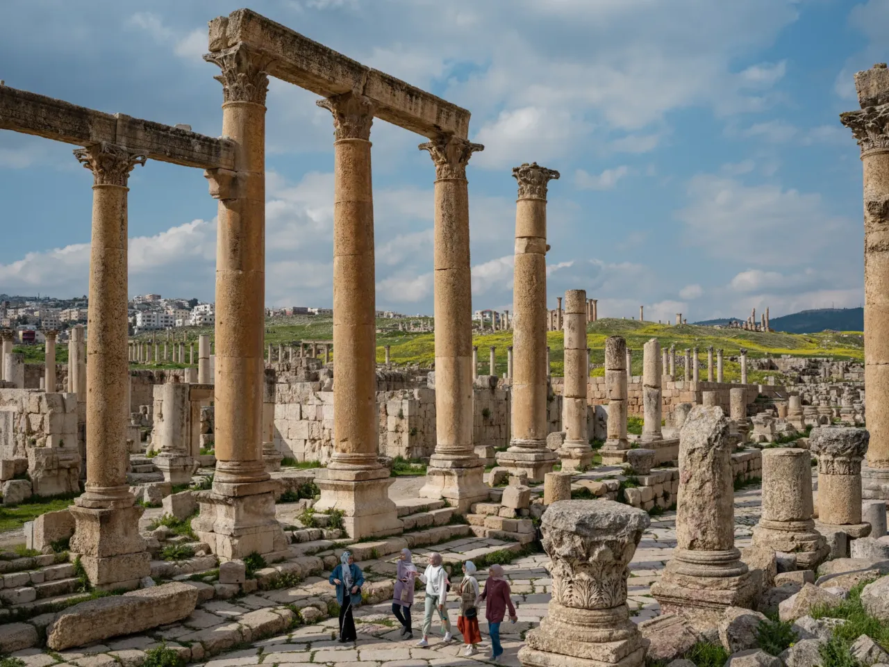 Photos: Scientists trace a butterfly migration route that is millions of years old 3 Palestinian refugees Ghina, Raghad, Yusra, Nahla, and Rahaf walk through Roman Ruins in Jordan. Painted lady butterflies have been migrating through these blooming fields for millions of years.