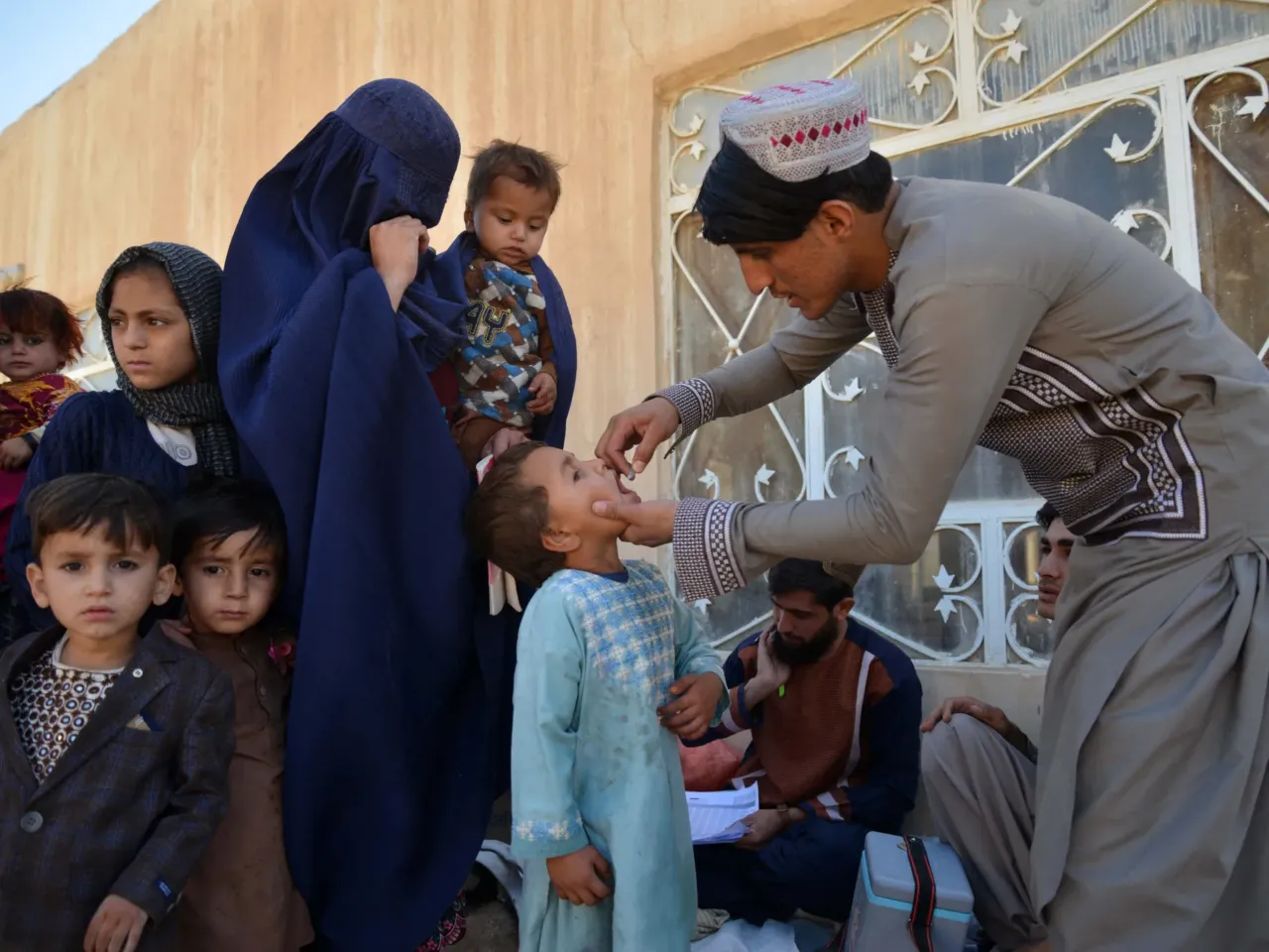 Could polio be poised for a comeback? 1 An Afghan health worker administers polio vaccine drops to a child during a polio vaccination campaign in Kandahar on December 23, 2024. The Taliban suspended door-to-door campaigns.