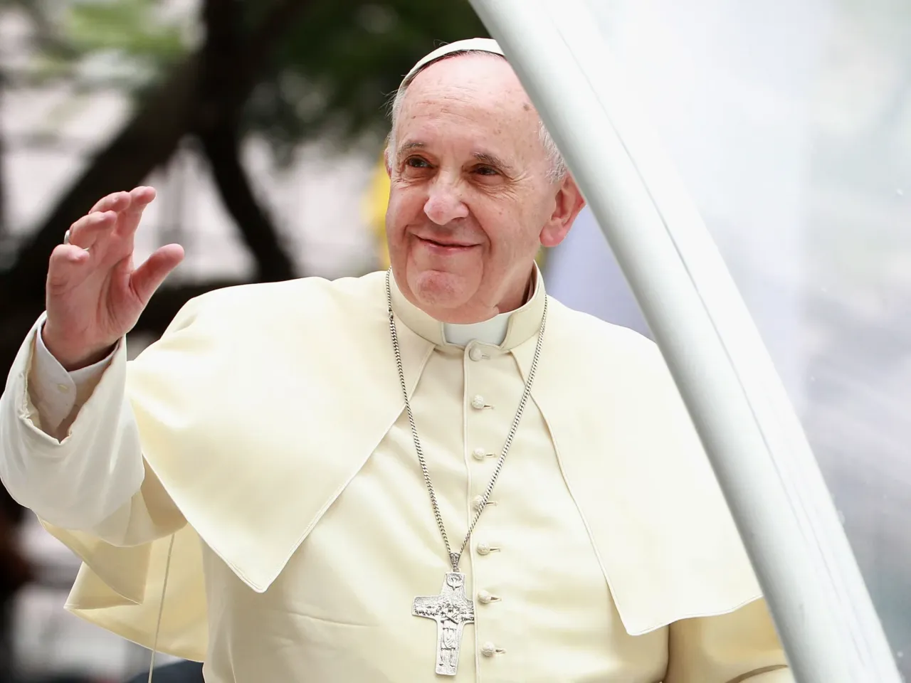 Pope Francis waves to thousands of followers as he arrives at the Philippines' Manila Cathedral on Jan. 16, 2015. During his papacy, Francis strove to reach out to what he called the "periphery" of the world in Asia, Africa and Latin America.