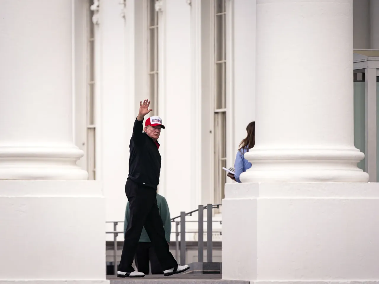 U.S. President Donald Trump waves as he arrives at the North Portico of the White House, on April 20, 2025 in Washington, D.C. Trump traveled to Trump National Golf Club in Sterling, Virginia, on Easter.