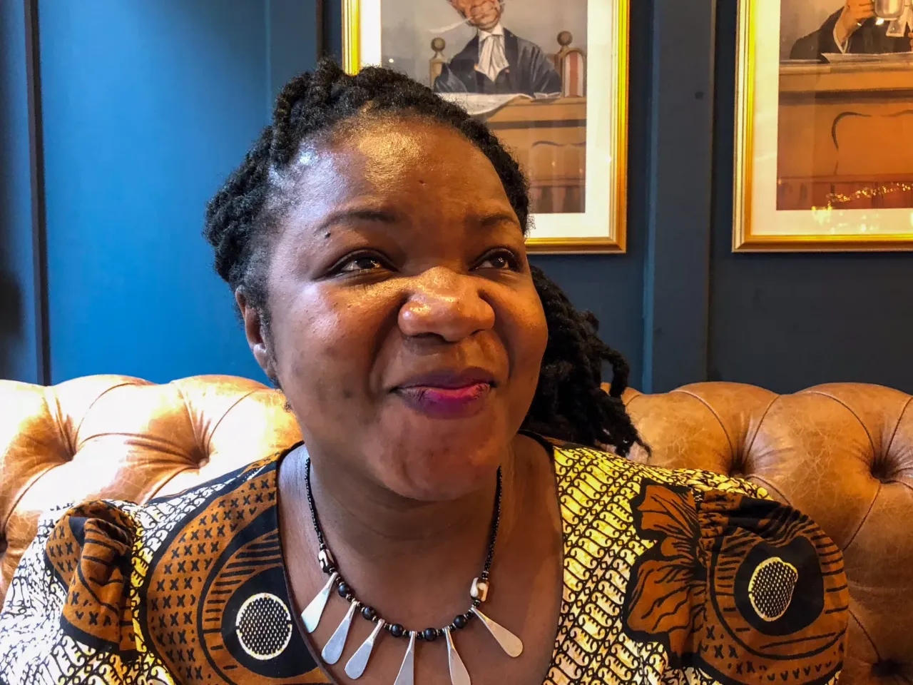 This 'Time icon' of 2025 is serious about her work -- and funny enough to do stand up 1 Angie Murimirwa in the English pub where I first met her in 2018. I know captions should be objective but ... she is ebullient, charismatic and has the most infectious laugh. Before the interview started, she said: "I'm going to go African on you" — and called out to a colleague from CAMFED across the room to come join us. "What does that mean, go African?" I ask. "In Africa, you always shout, 'Come here!' " she says and laughs.