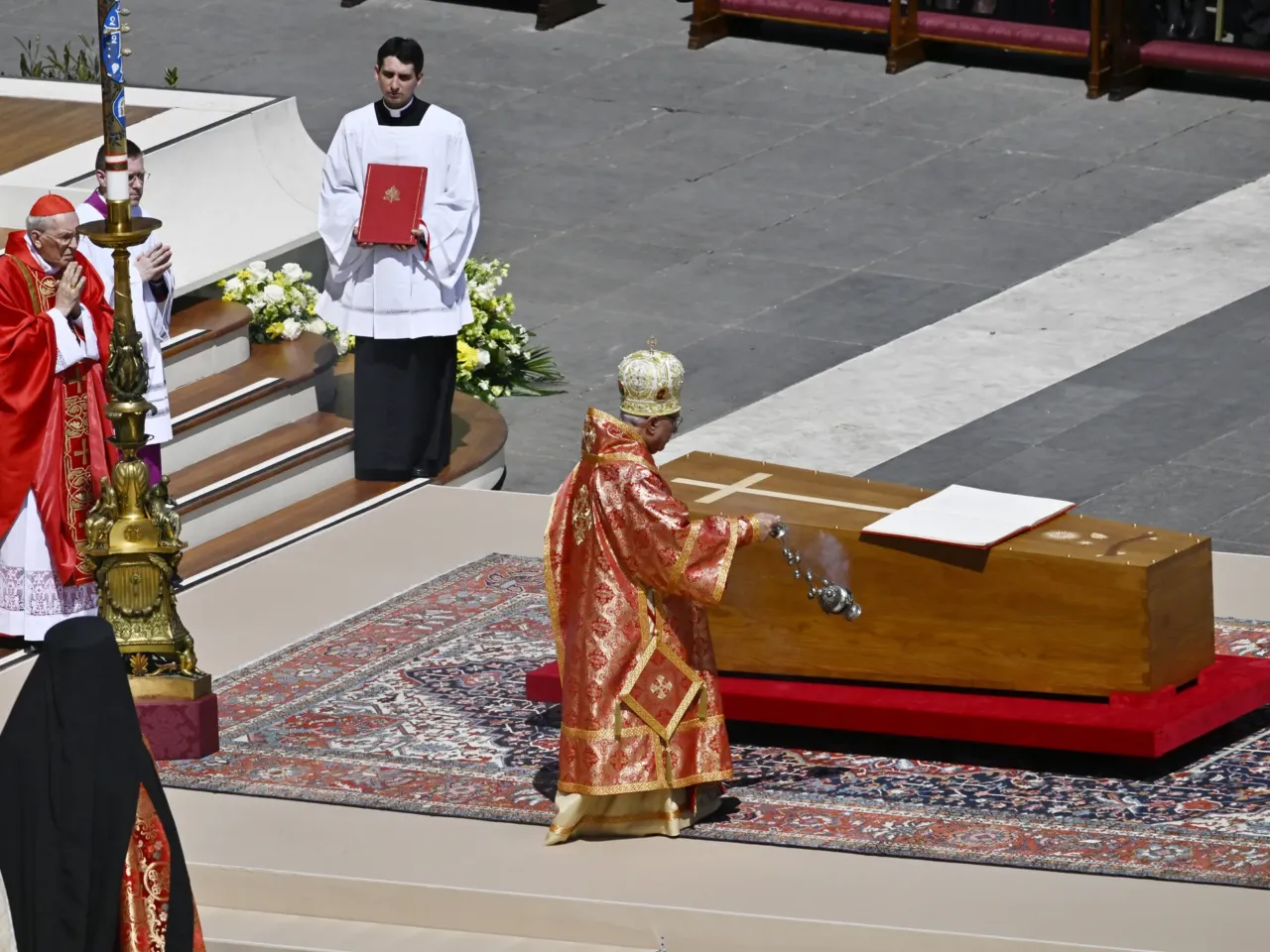 Youssef Absi, Patriarch of Antioch and All the Orient, of Alexandria and of Jerusalem and head of the Melkite Greek Catholic Church, blesses the coffin during the funeral of Pope Francis in St. Peter's Square on April 26, 2025 in Vatican City, Vatican.