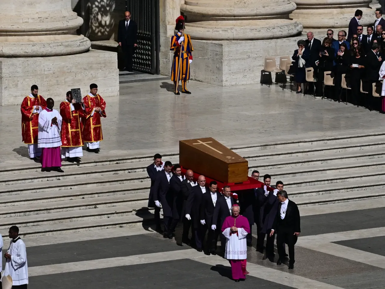 Crowds of mourners and dignitaries pay respects to Pope Francis at funeral service 2 Pallbearers carry the coffin of late Pope Francis during the funeral ceremony in St Peter's Square.