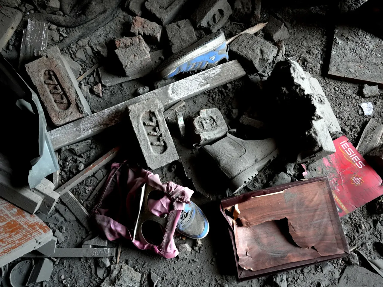 Homes destroyed and 1,500 detained in Kashmir as India cracks down following attacks 2 Shoes covered in dust and bricks in a destroyed house in Murran village in the Pulwama district, Kashmir, on April 26,2025.