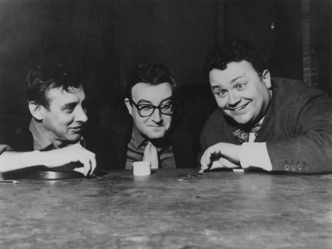 50 years of 'Monty Python and the Holy Grail': Its legacy and what it means to fans 4 From left to right, actors and comedians Spike Milligan, Peter Sellers and Harry Secombe of British radio comedy 'The Goon Show' prepare for a tiddlywinks contest, 1958. (Photo by Keystone Features/Hulton Archive/Getty Images)