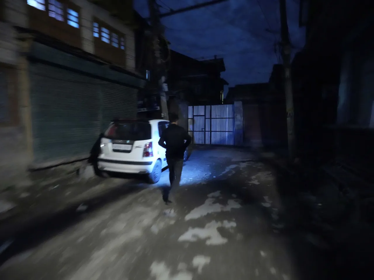 India and Pakistan trade attacks amid risk of war between nuclear states 2 A Kashmiri man using a cellphone light during a blackout is seen after residents of the city of Jammu reported hearing explosions and sirens in Srinagar, Indian-controlled Kashmir, Thursday.