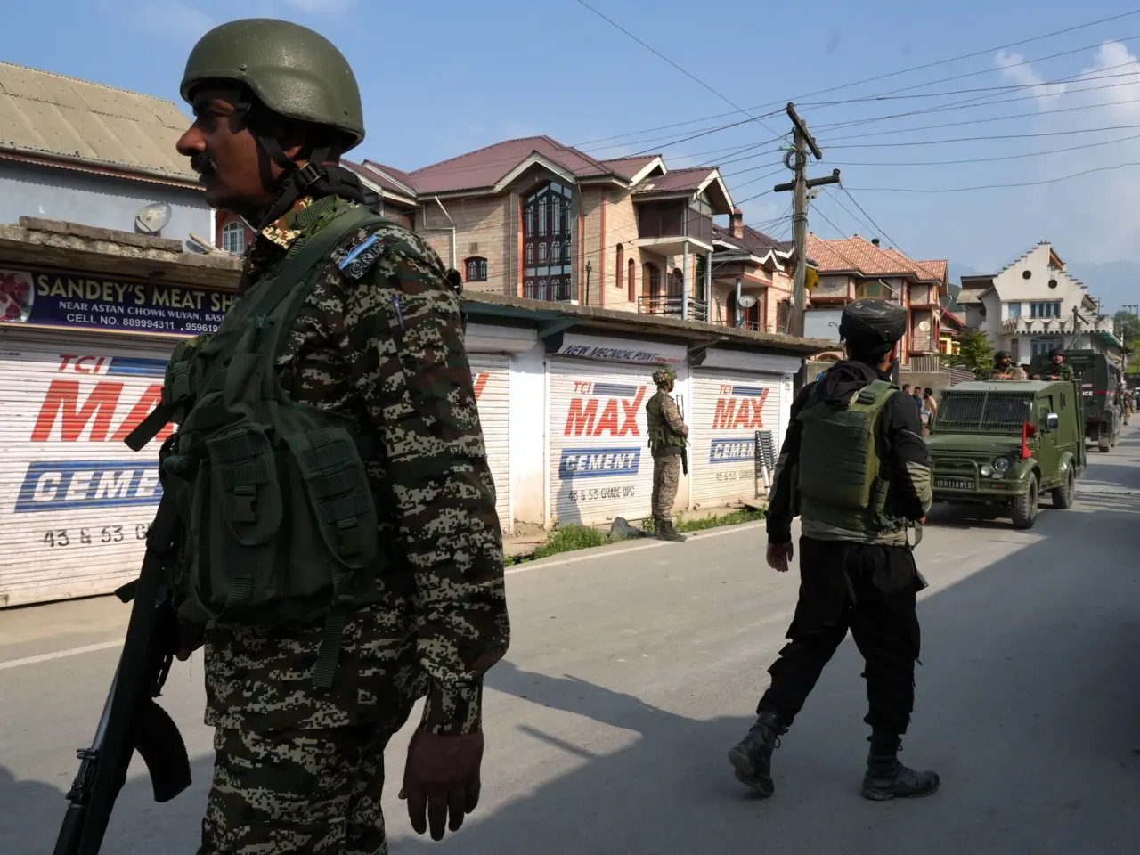 India-Pakistan ceasefire holds for a 2nd day 2 Indian army personnel patrol the streets in Wuyan, in Indian-administered Kashmir, May 7.