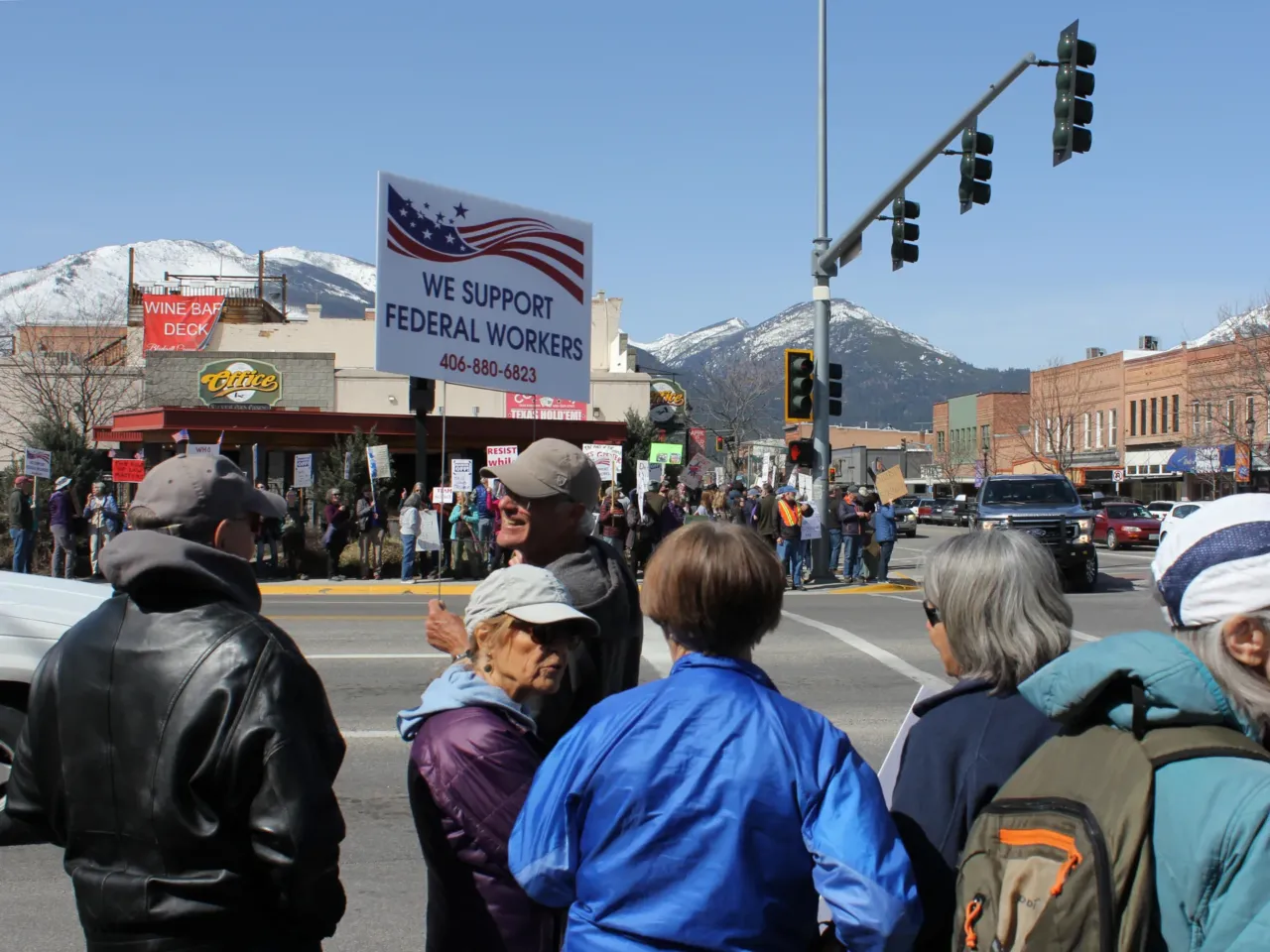 Hundreds of people join a protest in downtown Hamilton, Mont., in April supporting the work of federal employees as President Donald Trump oversees efforts to restructure the nation's government. Federal scientific research and forestry work are part of this small town's economic bedrock.