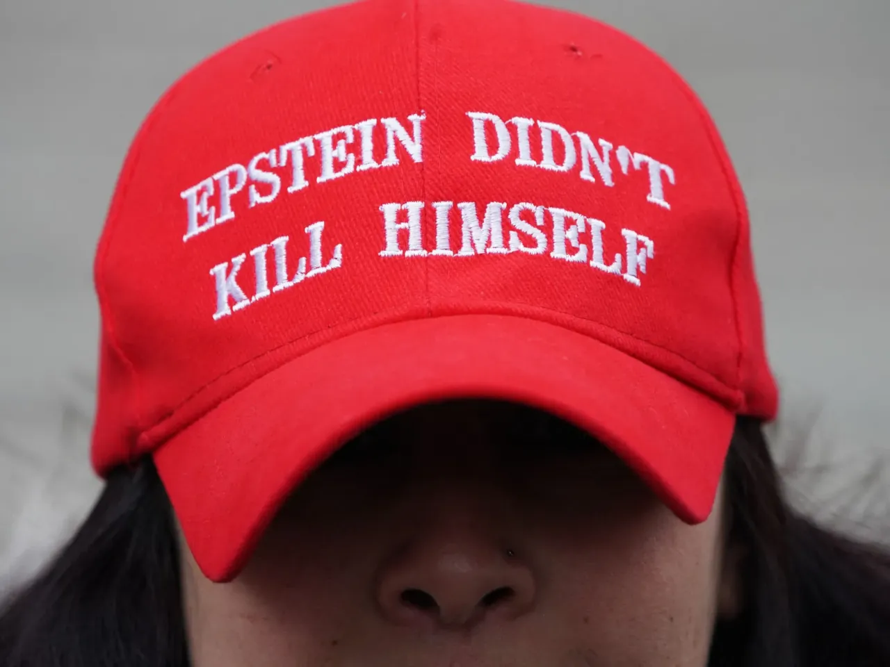 How conspiracy theorists explain Trump officials' pivots on Jeffrey Epstein 1 There's been public skepticism about Jeffrey Epstein's 2019 suicide across the political spectrum for years. In this image, Eva Policastro protests outside the Thurgood Marshall United States Courthouse as the trial of Ghislaine Maxwell began in New York on November 29, 2021. Maxwell was accused of recruiting underage girls for her former partner, the disgraced US financier Jeffrey Epstein, who killed himself in jail in 2019 while awaiting trial. In 2022, Maxwell was sentenced to 20 years in prison.