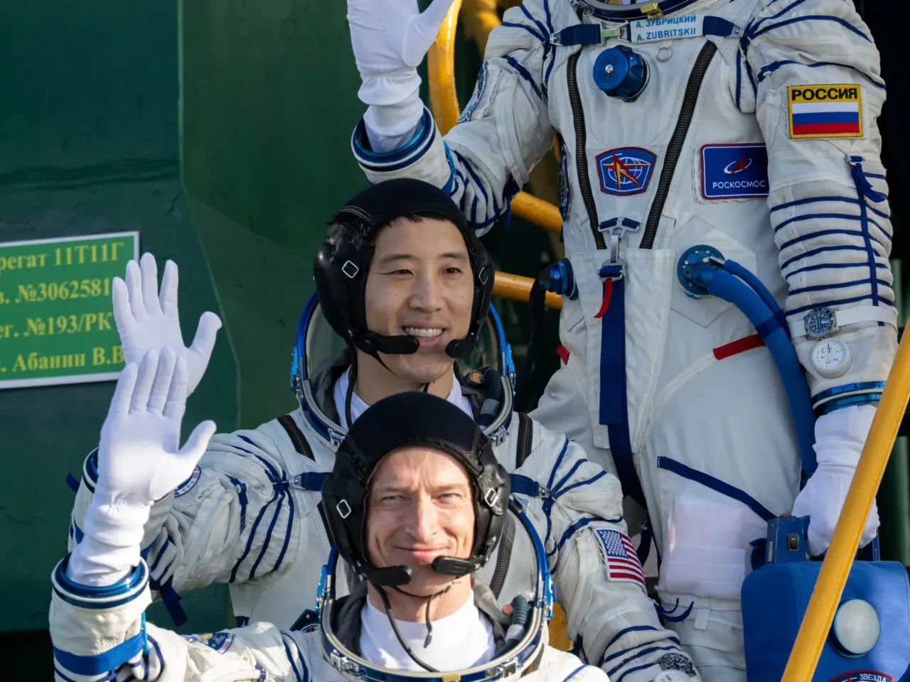 Navy SEAL-turned-doctor-turned-astronaut says he had a clear motivator — serve others 1 Roscosmos cosmonaut Sergey Ryzhikov, bottom, NASA astronaut Jonny Kim, middle, and Roscosmos cosmonaut Alexey Zubritskiy, top, wave farewell prior to boarding the Soyuz MS-27 spacecraft for launch on April 8, 2025 in Baikonur, Kazakhstan.