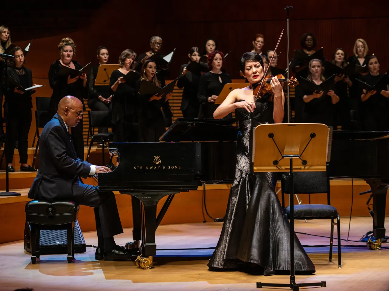Billy Childs (left, at the piano) wrote his first requiem, In the Arms of the Beloved, for violinist Anne Akiko Meyers (right), performed here with The Lyris Quartet and the Los Angeles Master Chorale.