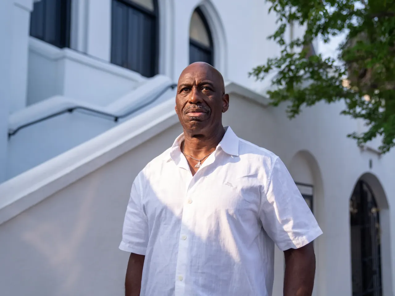 Melvin Graham, Jr., brother of Cynthia Graham Hurd, one of the nine Black worshippers killed at Emanuel AME. He wears a charm with Cynthia's image on his necklace. "When she was executed, I made a promise to be her voice," he says.