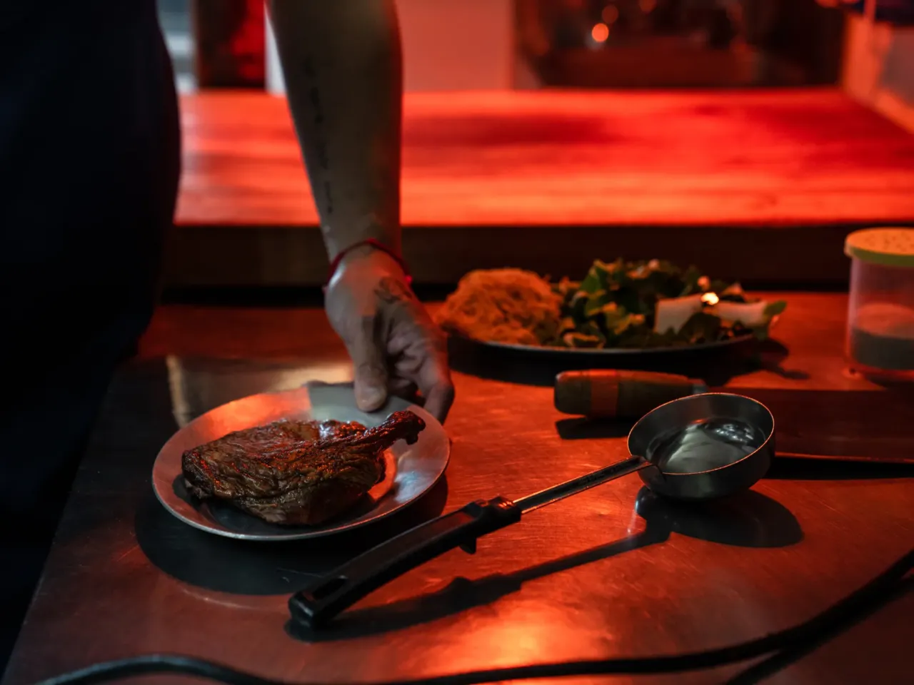 Chef Shuai Wang readies smoked duck for the fryer.  After shunning Chinese food in his youth, he's now embracing it.