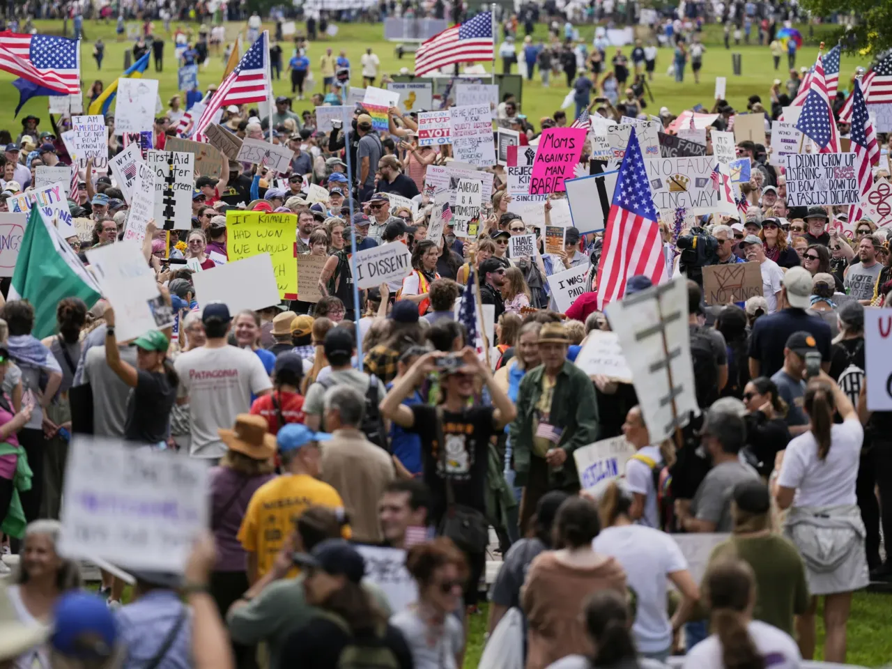Anti-Trump No Kings protests flood American streets ahead of military parade 3 People demonstrate during a "No Kings" protest Saturday, June 14, 2025, in Nashville, Tenn.