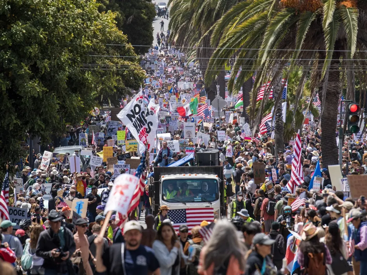 3 takeaways from the military parade and No Kings protests on Trump's birthday 4 Demonstrators hold signs as they march down Dolores Street protesting the Trump administration during the No Kings rally in San Francisco on Saturday.
