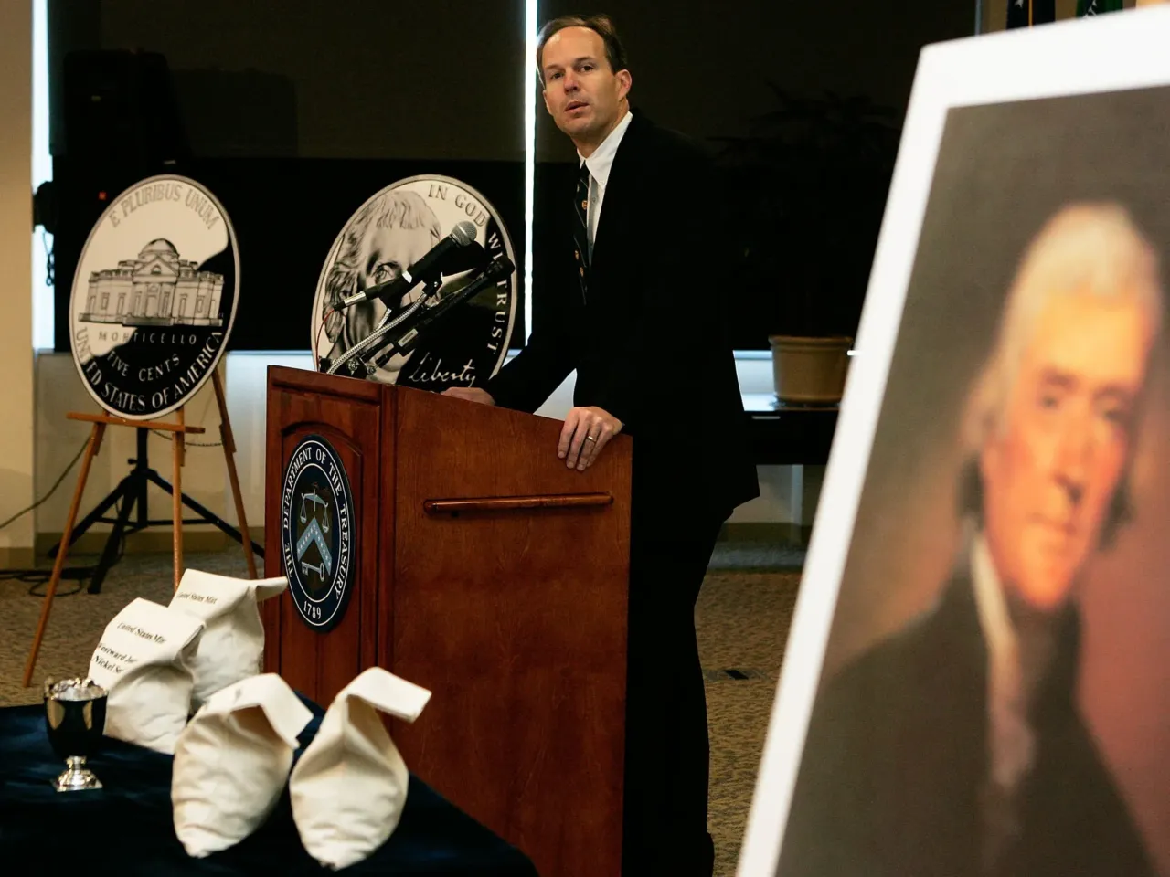 David Lebryk, who was then the acting director of the U.S. Mint, speaks at the unveiling of the new U.S. nickel during a ceremony January 12, 2006, in Washington, DC. The new nickel, last of the Westward Journey Nickel Series, was the first U.S. coin featuring the image of a president facing forward instead of in profile.